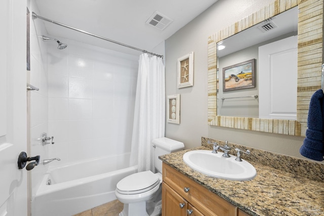 bathroom featuring visible vents, vanity, shower / tub combo, and toilet