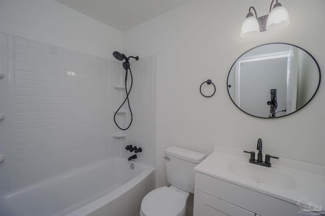 full bathroom with vanity, tiled shower / bath combo, and toilet