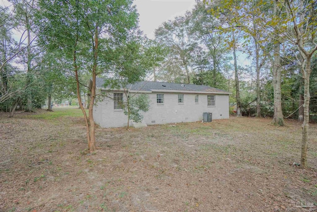 rear view of house with central air condition unit