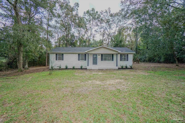 ranch-style house with a front lawn