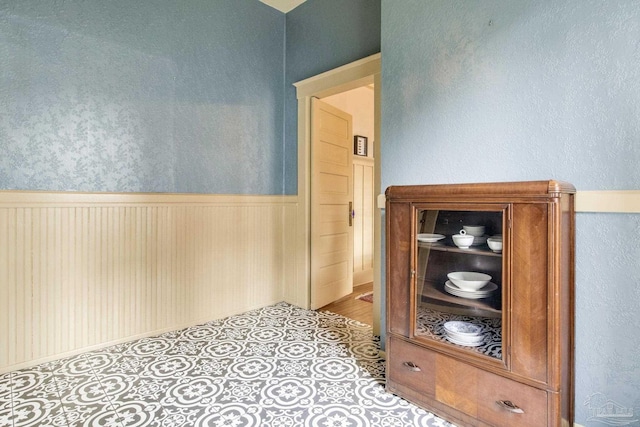 hallway with a wainscoted wall