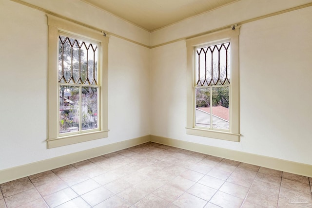 spare room featuring baseboards