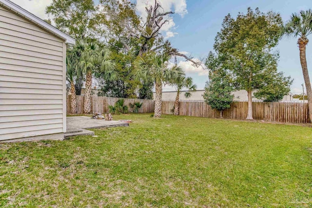 view of yard featuring a patio area and a fenced backyard