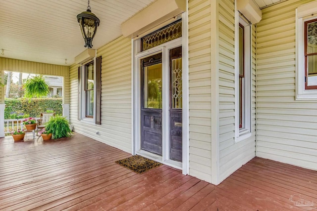 wooden terrace with a porch