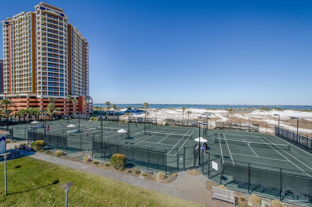 view of sport court with a water view