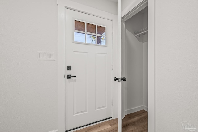 interior space with light wood-style floors and baseboards