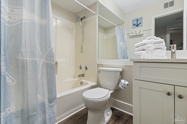 full bathroom with hardwood / wood-style flooring, vanity, shower / bath combination with curtain, and toilet