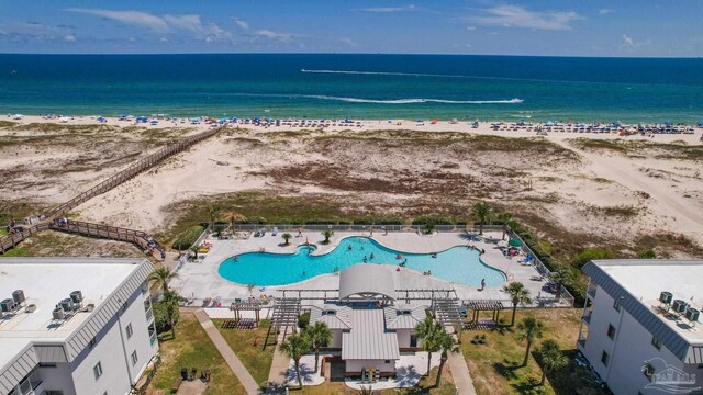 bird's eye view featuring a view of the beach and a water view