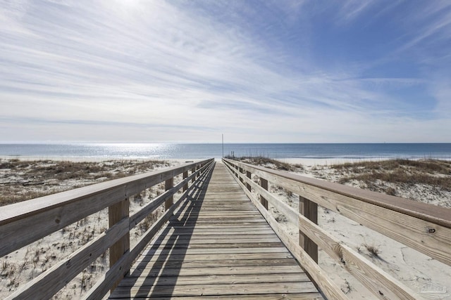 view of home's community featuring a view of the beach and a water view