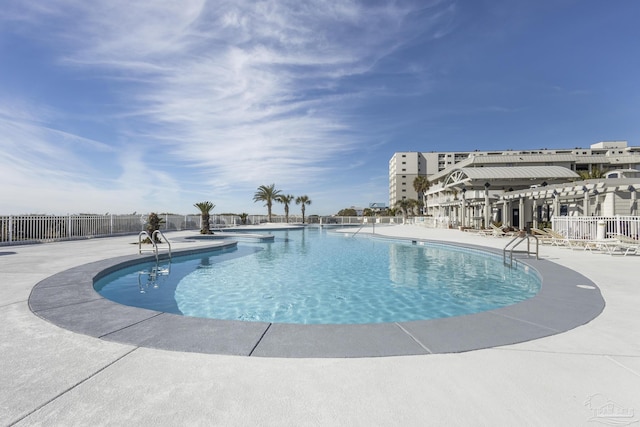 view of swimming pool featuring a patio