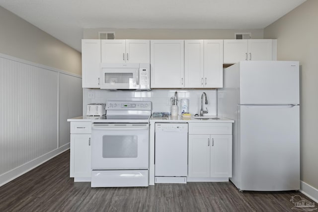 kitchen featuring white appliances, dark hardwood / wood-style flooring, sink, and white cabinets