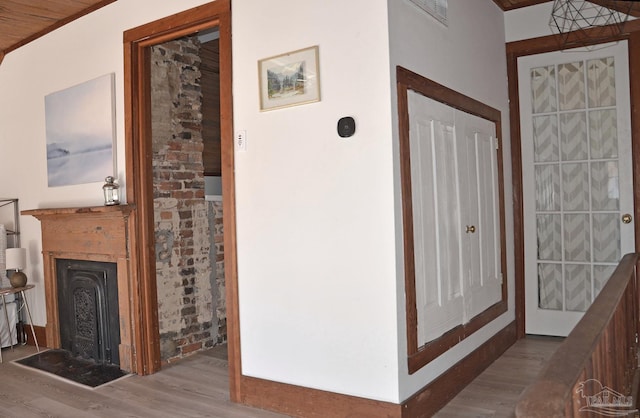 corridor featuring wood finished floors