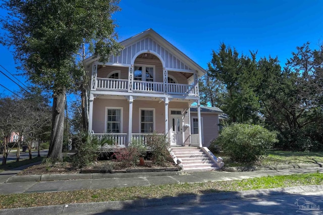 view of front of house featuring a porch and a balcony