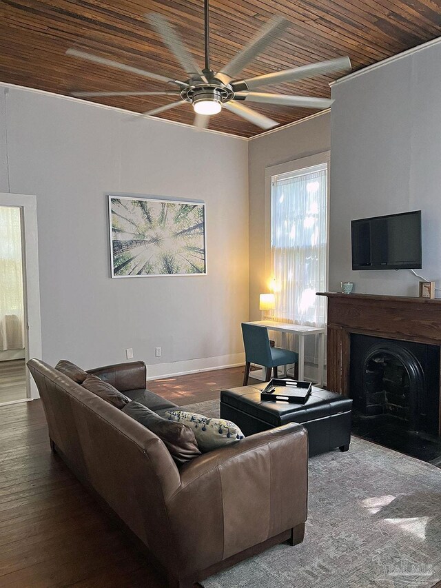 living room with a fireplace with flush hearth, ceiling fan, wood finished floors, wooden ceiling, and baseboards