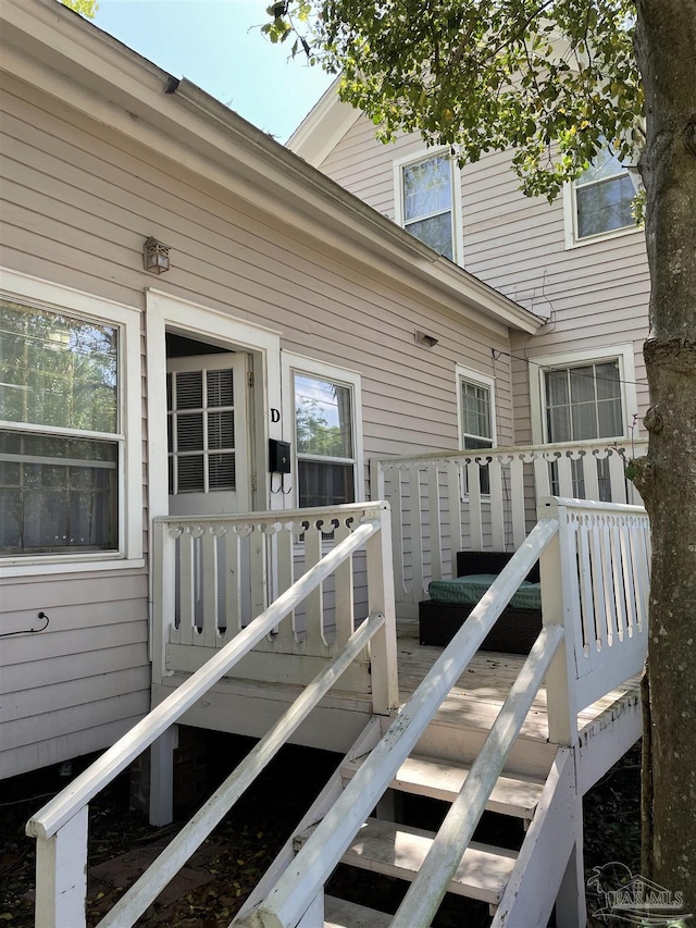 property entrance featuring a wooden deck