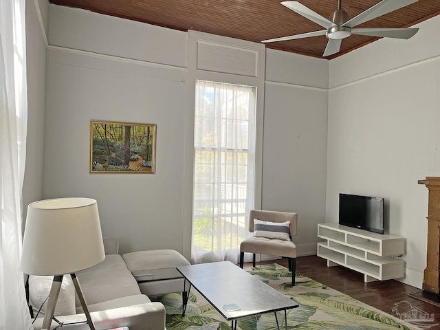 living area with dark wood-style floors and ceiling fan