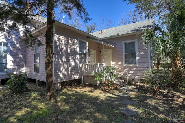 view of front of home with roof with shingles