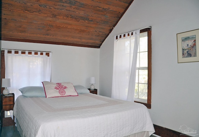 bedroom with vaulted ceiling, multiple windows, and wooden ceiling