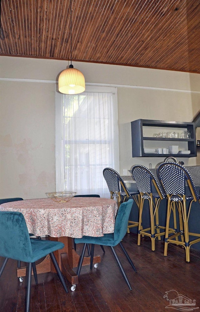 dining room featuring wooden ceiling and hardwood / wood-style flooring