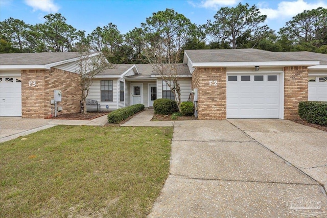 ranch-style home featuring a front yard and a garage