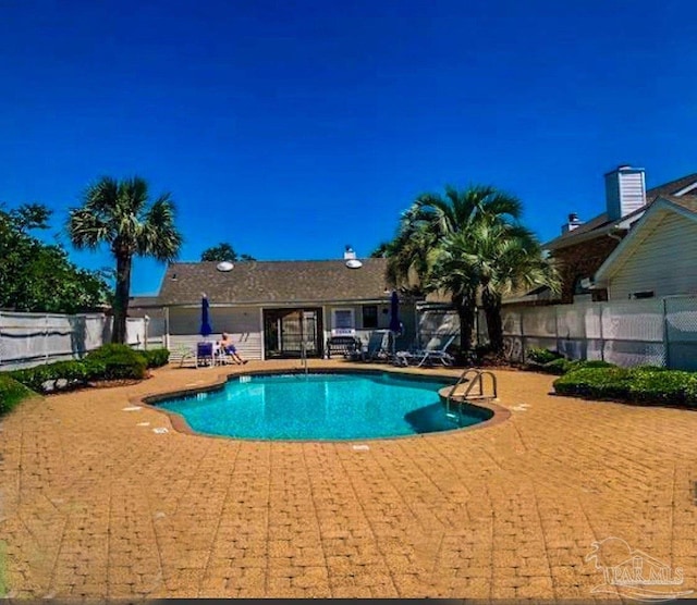 view of pool featuring a patio