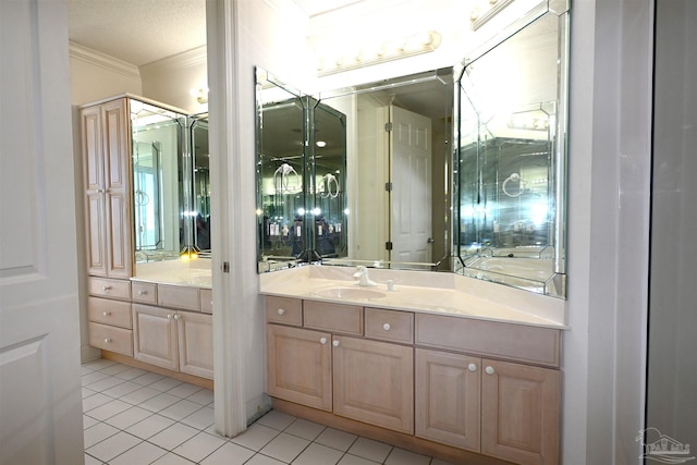 bathroom featuring tile patterned floors, vanity, a textured ceiling, and ornamental molding