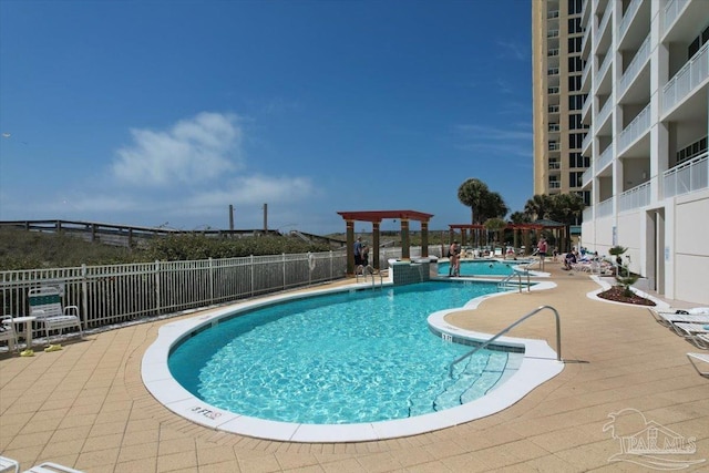 view of swimming pool with a patio area