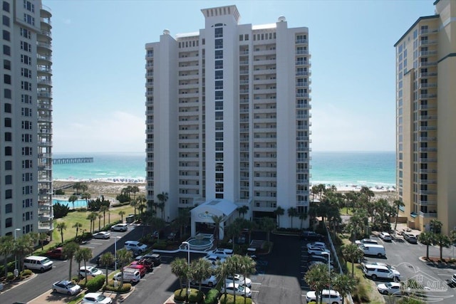 view of property featuring a water view and a view of the beach