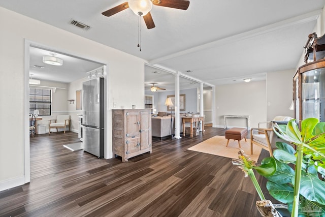 living room featuring dark hardwood / wood-style floors and ceiling fan