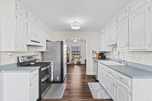 kitchen featuring sink, ceiling fan, white cabinets, and appliances with stainless steel finishes