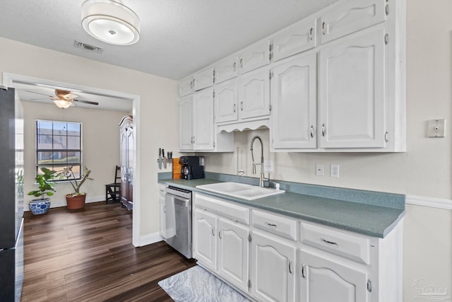 kitchen featuring sink, dark wood-type flooring, ceiling fan, white cabinets, and stainless steel dishwasher