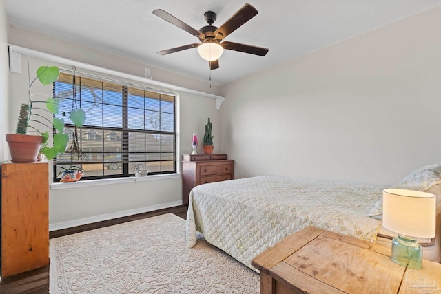 bedroom with hardwood / wood-style floors and ceiling fan