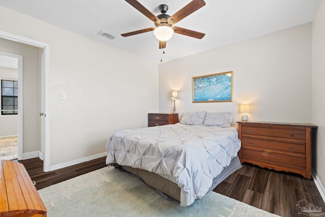 bedroom featuring dark hardwood / wood-style flooring and ceiling fan