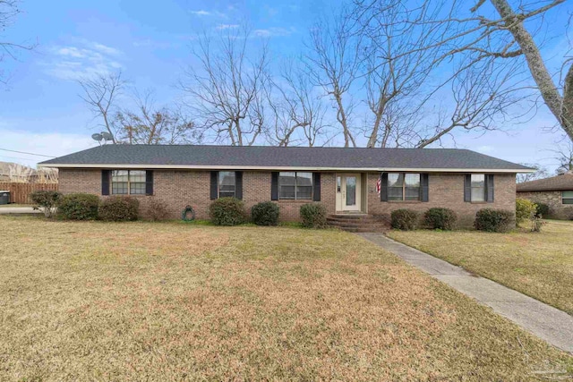 ranch-style home featuring a front yard