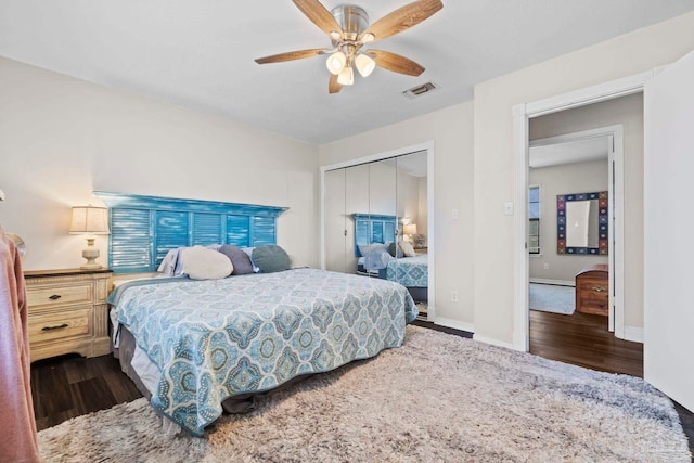 bedroom with dark hardwood / wood-style flooring, a closet, and ceiling fan