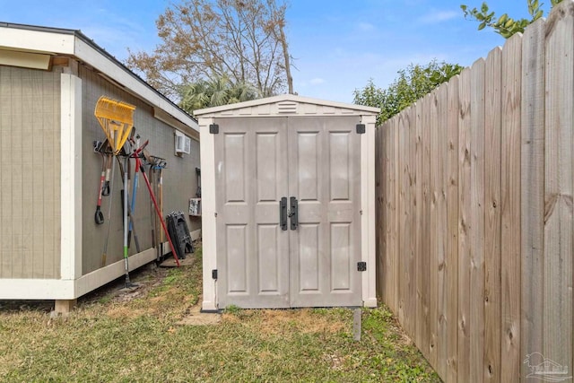 view of outdoor structure with a lawn