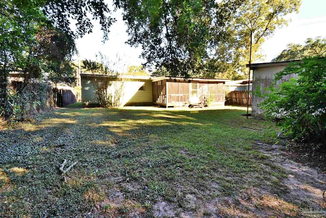 view of yard featuring a sunroom