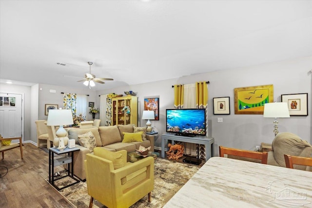 138 Georgia St, Crestview, FL 32536 - living room featuring wood finished floors, ceiling fan, and baseboards