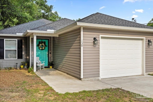 138 Georgia St, Crestview, FL 32536 - ranch-style home with a shingled roof, a garage, and concrete driveway