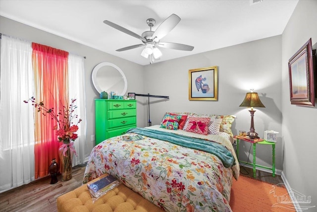 138 Georgia St, Crestview, FL 32536 - bedroom featuring baseboards, ceiling fan, and wood finished floors