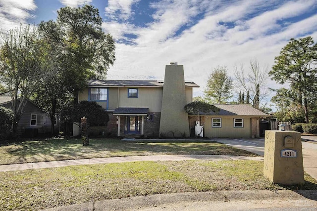 view of front property with a front lawn