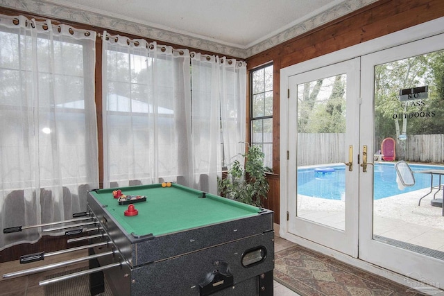 recreation room with pool table, ornamental molding, and french doors