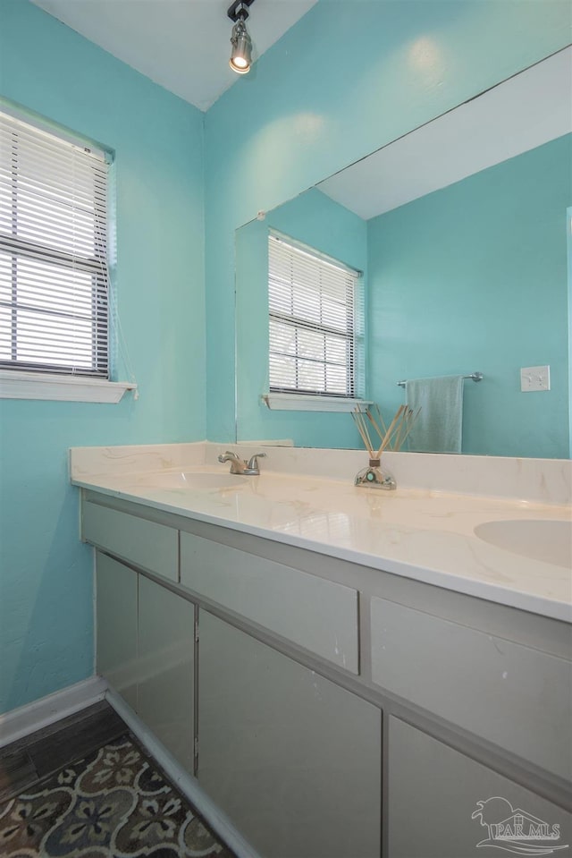 bathroom with tile patterned floors and vanity