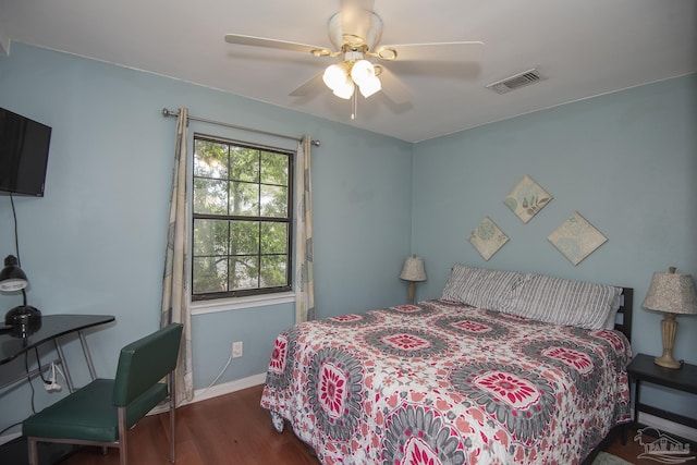 bedroom with ceiling fan and dark hardwood / wood-style floors