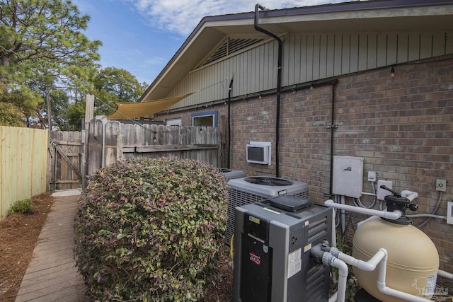 view of side of home with central air condition unit