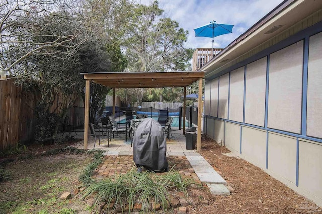 view of yard with a pergola and a patio area