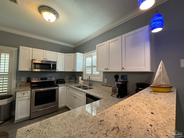 kitchen with white cabinetry, sink, and appliances with stainless steel finishes