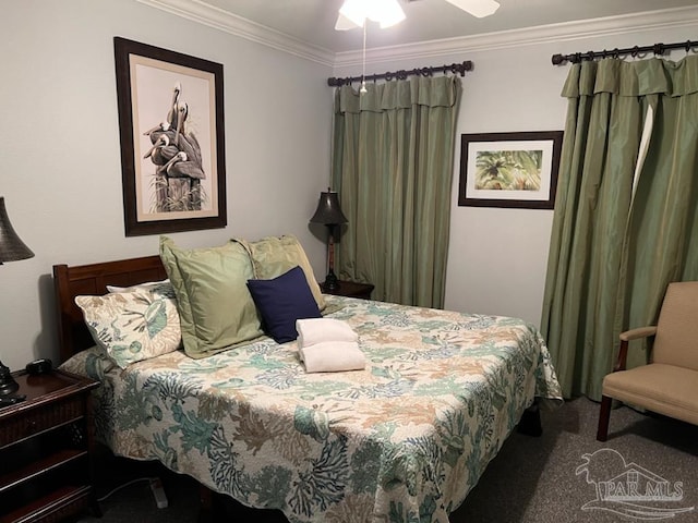 bedroom featuring dark colored carpet, ceiling fan, and ornamental molding