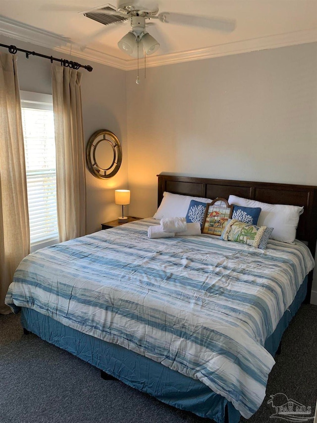 bedroom featuring ceiling fan, carpet floors, and crown molding