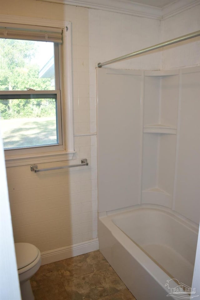 bathroom with shower / tub combination and toilet